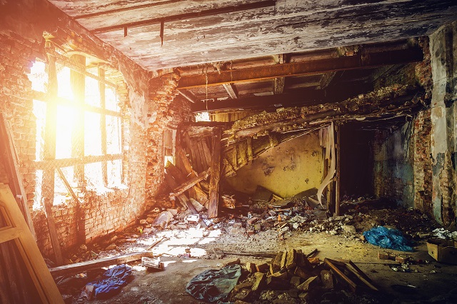 Inside ruined abandoned house building after disaster, war, earthquake, Hurricane or other natural cataclysm.