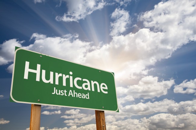 Hurricane Green Road Sign with Dramatic Clouds and Sky.