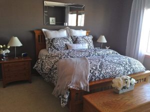 Master bedroom with purple comforter