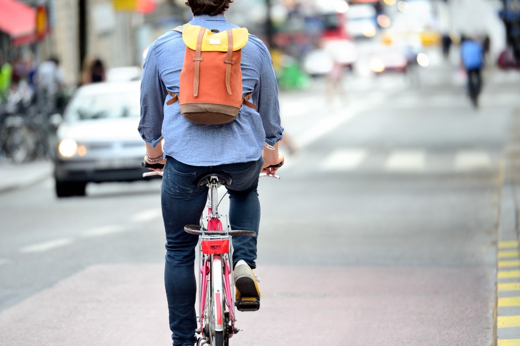 Commuter on bike in traffic