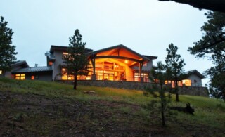 Lit-up house on a hill