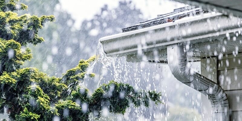 aluminum gutters full of rain