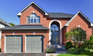 red brick home with attached garage