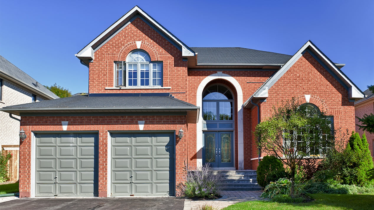 red brick home with attached garage