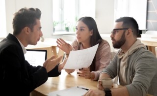 Angry couple disputing about mortgage or construction with lawye