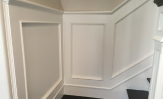 White Wainscoting Installed On Stairs