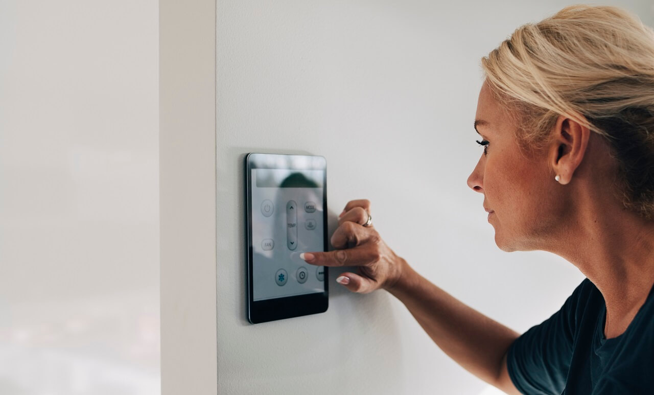 woman updates thermostat