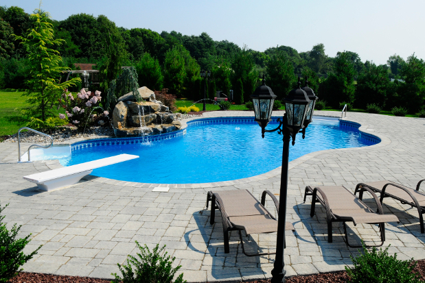 Swimming Pool with Diving Board and Waterfall