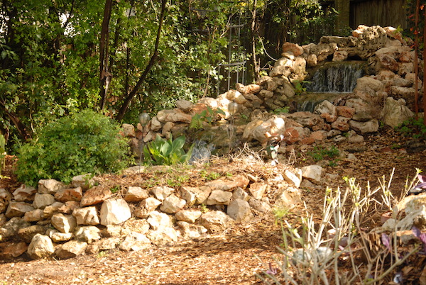 Backyard waterfall on stones