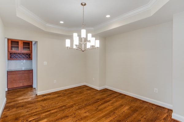 Empty room with white tray ceiling