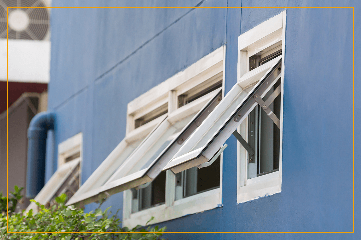 awning windows on blue house