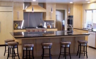 Kitchen with stainless steel backsplash