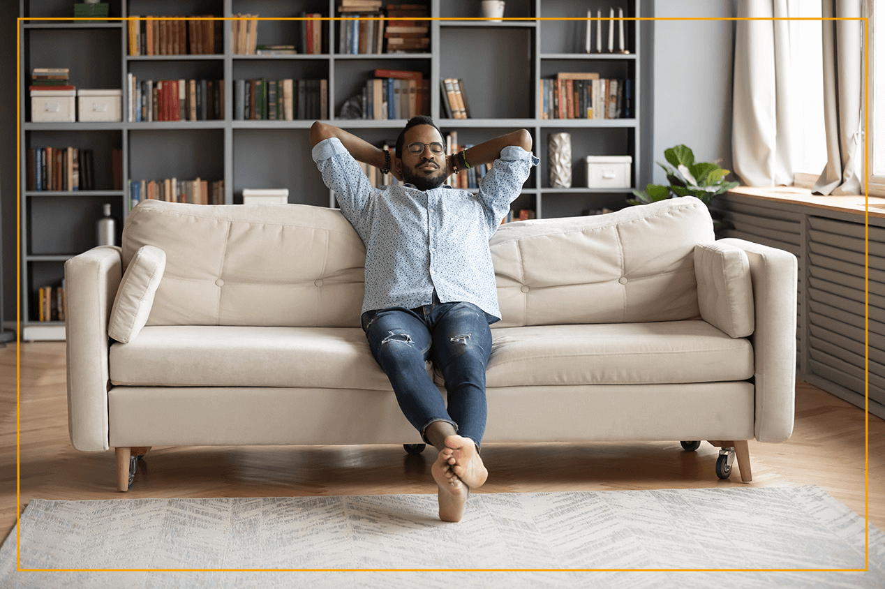 man relaxing on couch