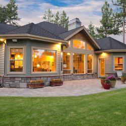 Family home with patio and landscaping in the summer