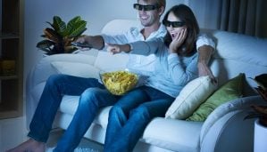 Couple watching movie at home