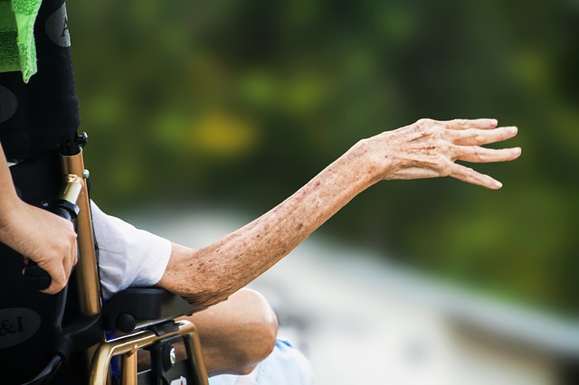 Elderly woman in wheelchair.