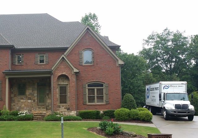 Moving truck in driveway.