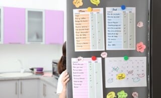 Family calendar and to do lists hanging on refrigerator