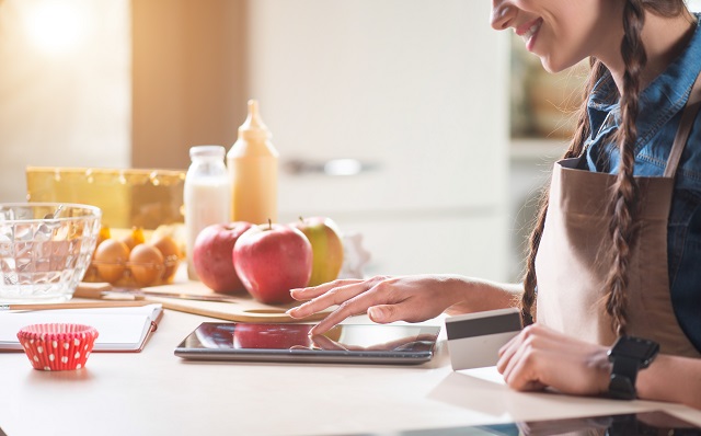 Smiling woman using tablet