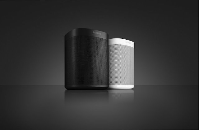 Sonos One device on sleek black surface