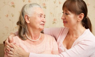 Senior woman with their caregiver at home.