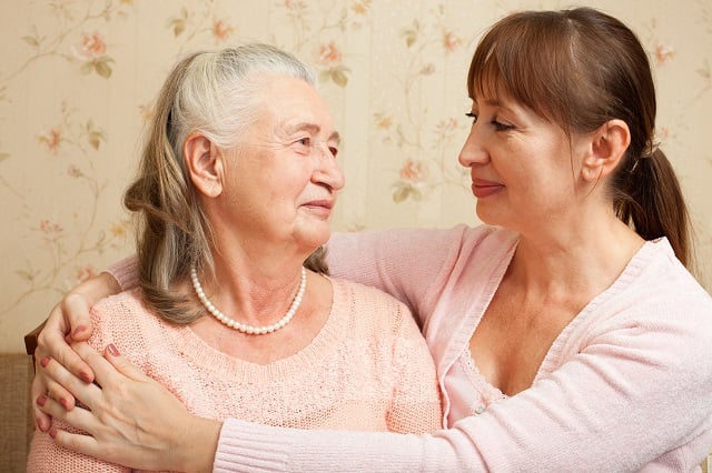 Senior woman with their caregiver at home.