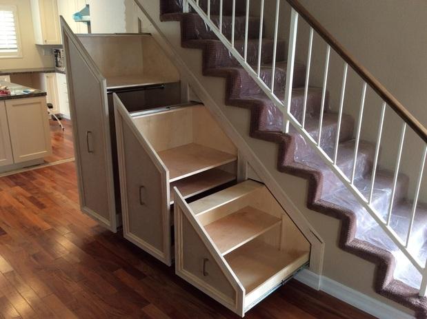 Pull out shelves under stairway