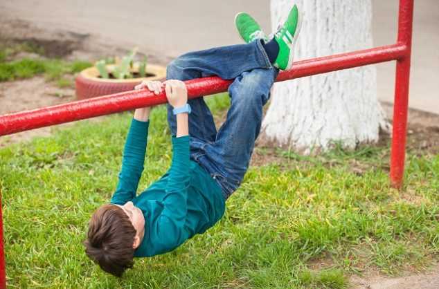 young happy child boy playing outdoors