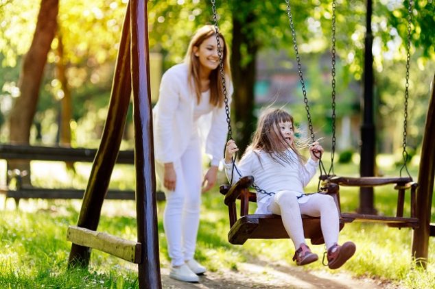 Differently-abled child enjoying the swing