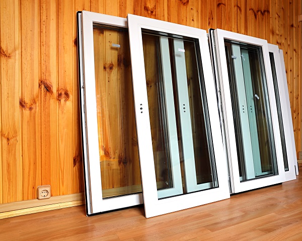 Installation of plastic windows in the wooden house