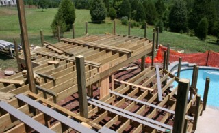 surrounding deck framing being constructed around the pool