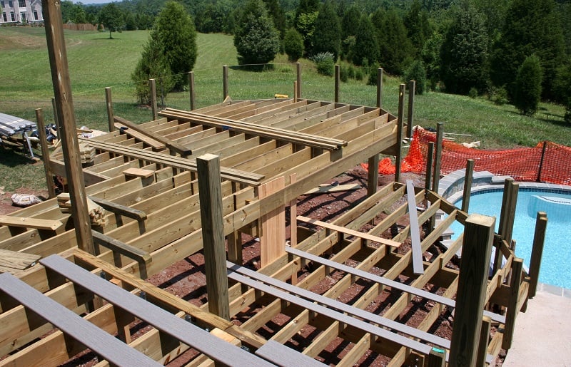 surrounding deck framing being constructed around the pool