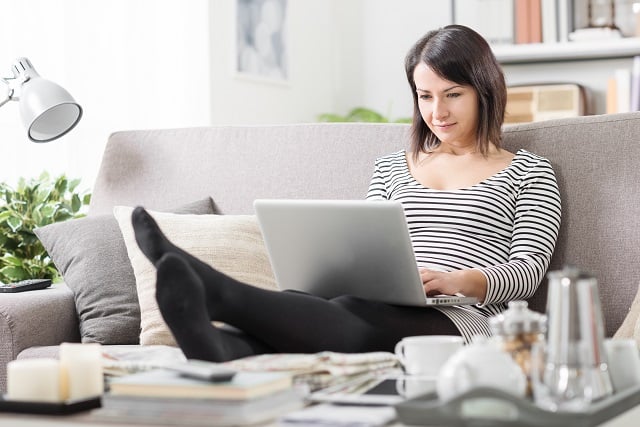 Woman at home working on her laptop