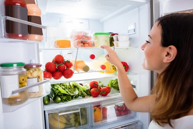 Open fridge filled with fresh foods