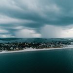 Beach town surrounded by clouds