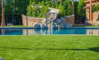 Pool Installation with slide and turf surround