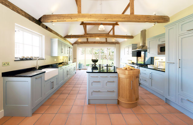 Huge farmhouse kitchen with exposed wood ceiling beams