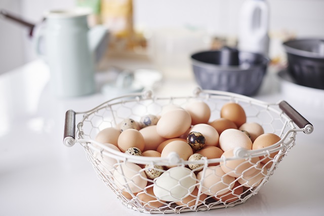 Wire basket full eggs on kitchen counter