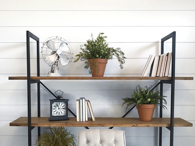 White Shiplap Wall behind Shiplap Bookshelves