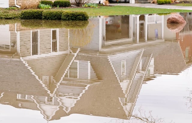 Reflection of suburban home in stormwater flood