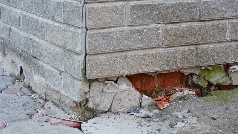 concrete and brick foundation in need of repair