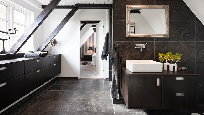 dark wood bathroom with granite stone tile floors