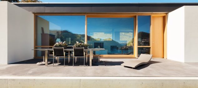 cement modern home with concrete patio