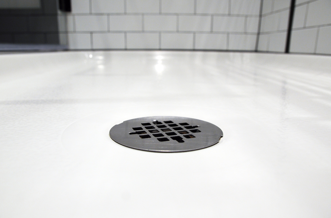 close up of white acrylic shower floor