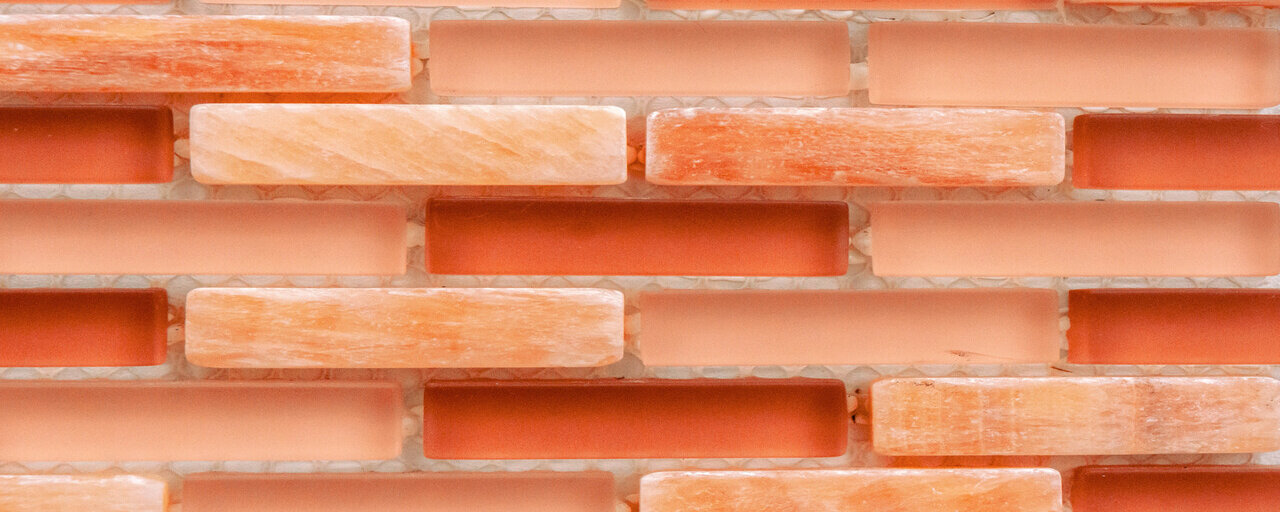 red and pink glass shower tile