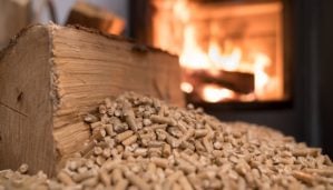 Wood stove heating with in foreground wood pellets - economical heating system concept