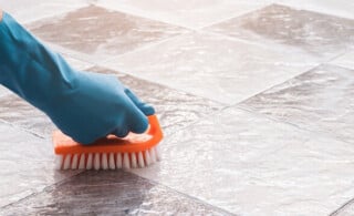 hand washing a tile floor