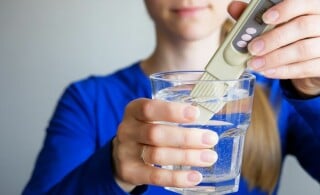 lab tech tests drinking water quality