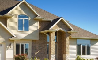 Mixed Materials House With Stone, Brick, Vinyl Siding