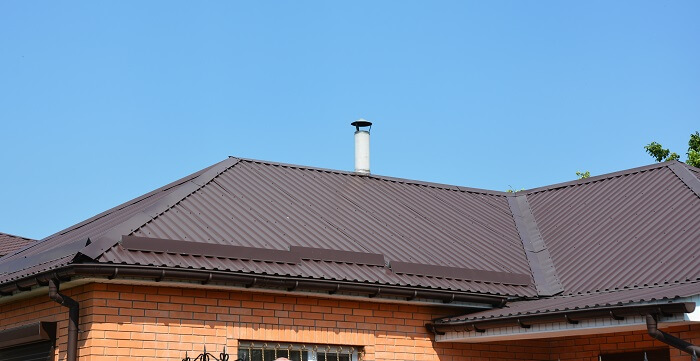 metal roof on brick house